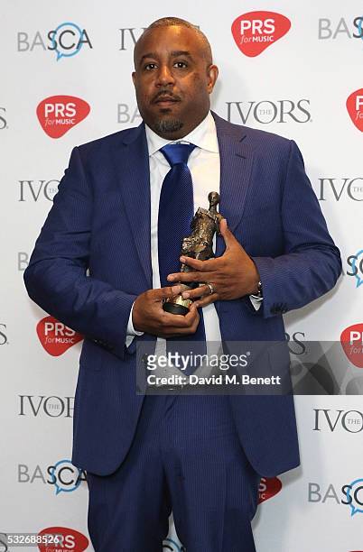 Wayne Hector poses after winning the award for International Achievement in the winners room during the Ivor Novello Awards 2016 at The Grosvenor...