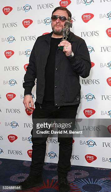 Wayne Hector poses after winning the award for The Ivors Inspiration Award in the winners room during the Ivor Novello Awards 2016 at The Grosvenor...
