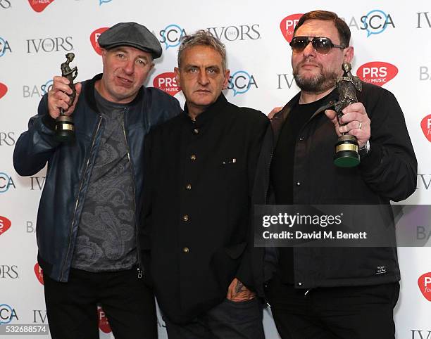 Mark Day, Paul Ryder and Shaun Ryder pose for a photo after winning the award for The Ivors Inspiration Award in the winners room during the Ivor...