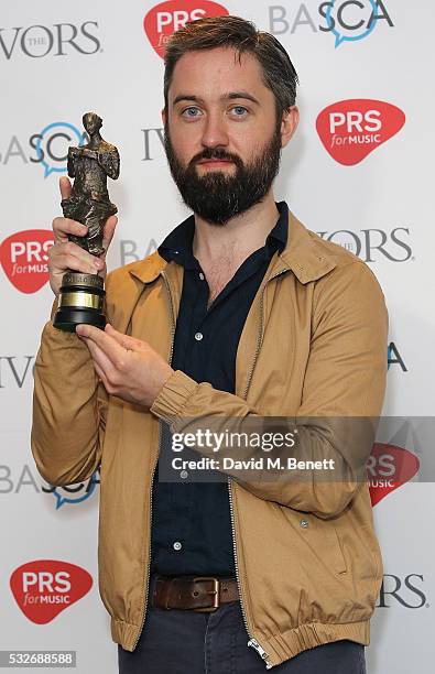 Conor O'Brien poses after winning the award for the Album Award in the winners room during the Ivor Novello Awards 2016 at The Grosvenor House Hotel...