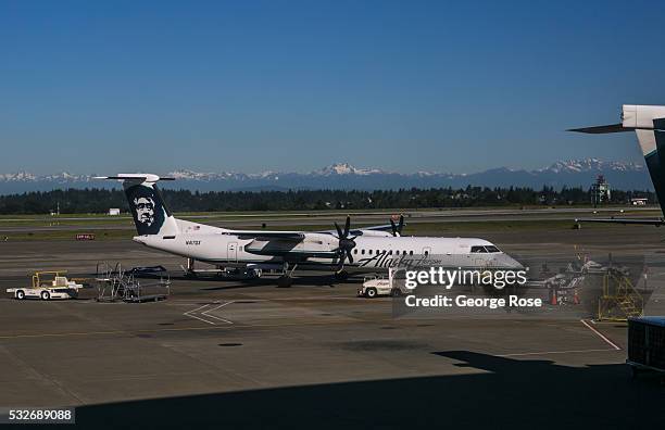 The snowcapped Olympic Mountains can be seen from the Alaska Airlines terminal at Seattle-Tacoma International Airport on May 2 in Seattle,...