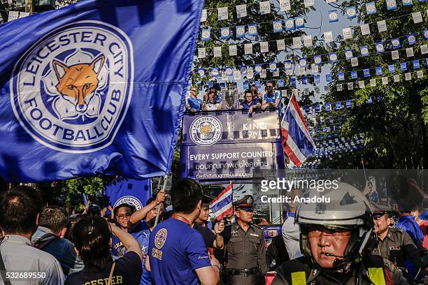 The Leicester City team take part in an open-top bus parade through Bangkok downtown to celebrate winning the Barclays Premier League title in...