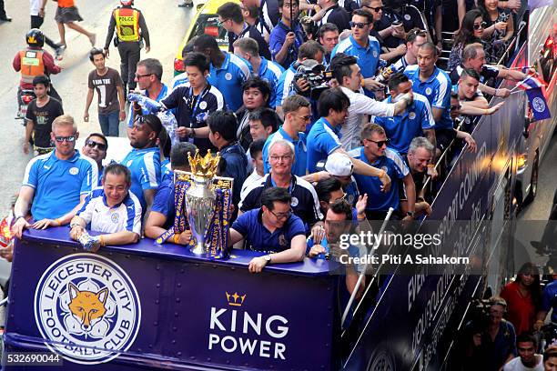 Leicester City's manager Claudio Ranieri, Chairman Vichai Srivaddhanaprabha, Vice Chairman Aiyawatt Srivaddhanaprabha and team players greet locals...