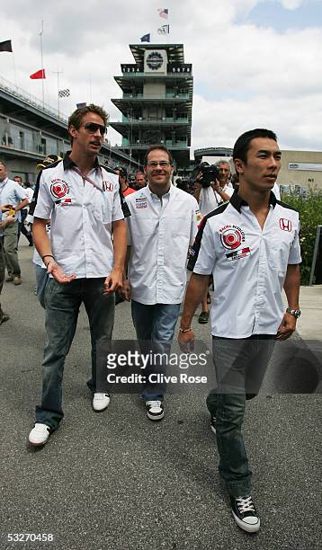 Jenson Button of England and B.A.R. - Honda, Jacques Villeneuve of Canada and Sauber, and Takuma Sato of Japan and B.A.R. - Honda attend a meeting...