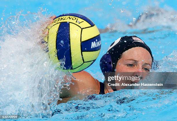 Kelly Rulon of the U.S. Swims with the ball during the game against China in the women's water polo preliminary match during the XI FINA World...