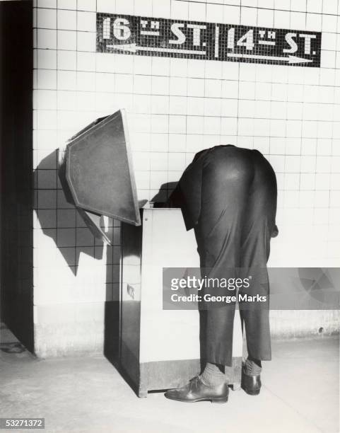 executive with head in public trash receptacle - buttock photos stock pictures, royalty-free photos & images