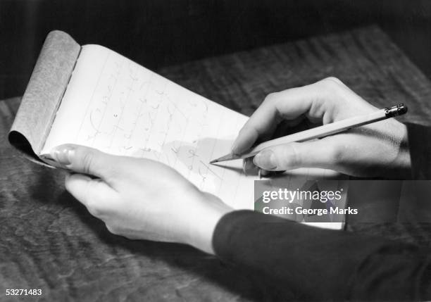 stenographer's hands with pad and pencil - stenographie stock-fotos und bilder