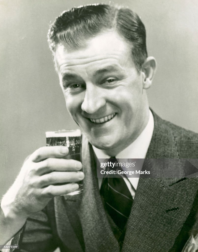 Man raises beer glass