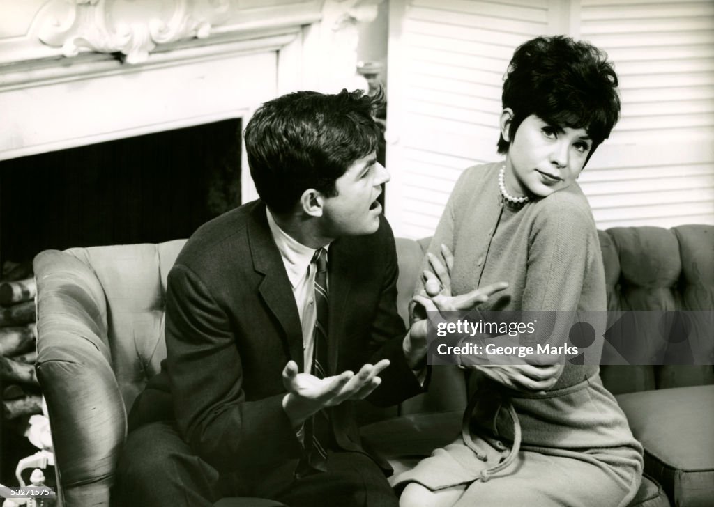 Couple sitting on sofa