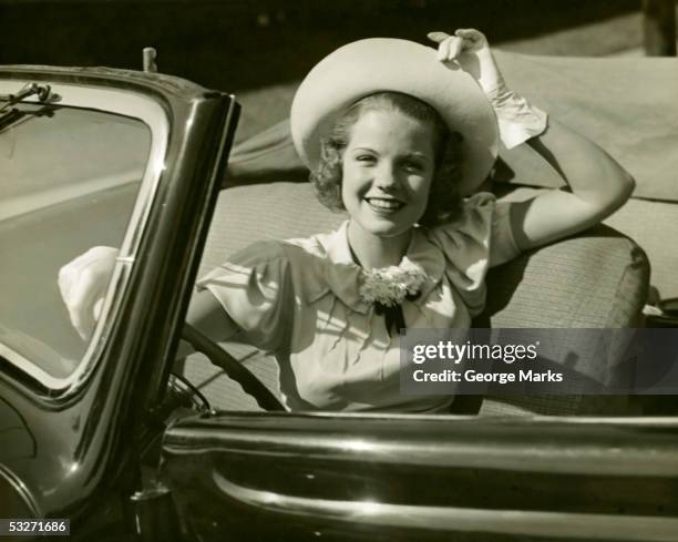 woman at wheel of convertible - woman-driving-car-1950s stock pictures, royalty-free photos & images