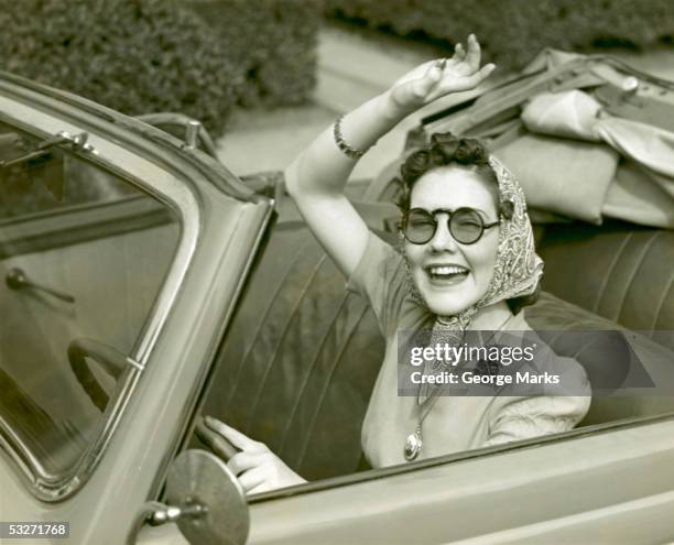 woman at wheel of convertible - 1950's cars stock pictures, royalty-free photos & images