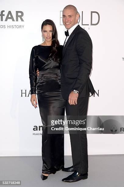 Model Adriana Lima and her boyfriend Joe Thomas attend the amfAR's 23rd Cinema Against AIDS Gala at Hotel du Cap-Eden-Roc on May 19, 2016 in Cap...