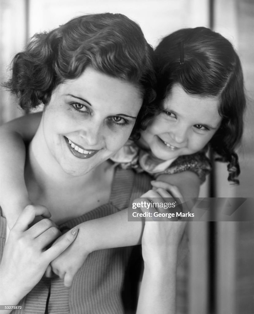 Portrait of mother & daughter