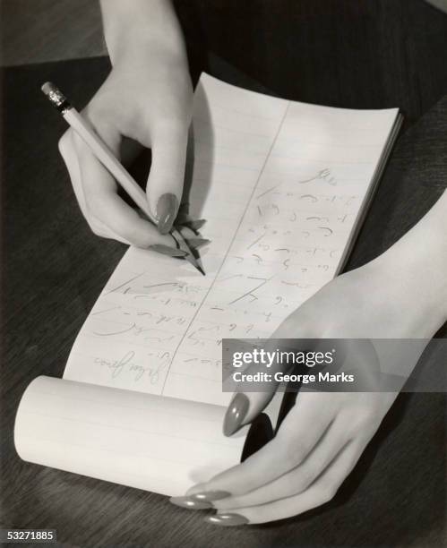 close-up of stenographer's hands taking notes - court reporter stock pictures, royalty-free photos & images