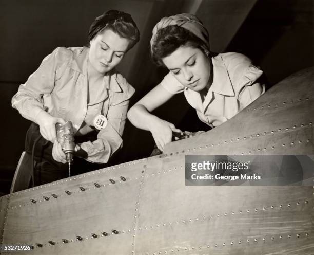 women working on ww ii aircraft assembly - world war ii stock pictures, royalty-free photos & images