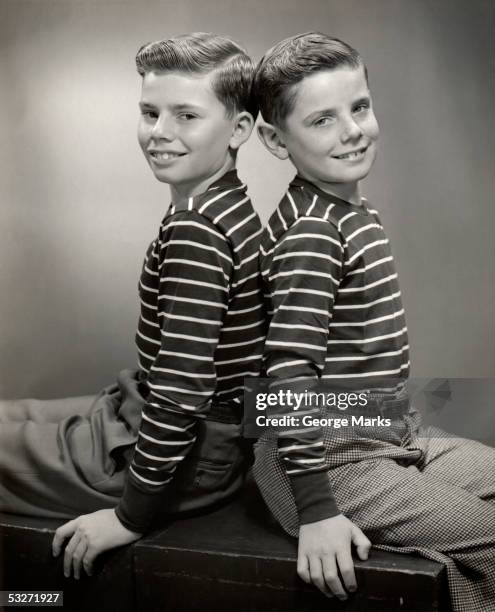 portrait of two brothers - identical twin stock pictures, royalty-free photos & images