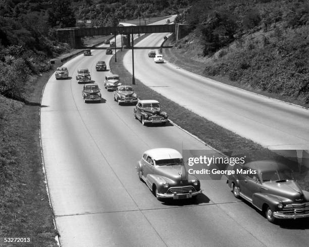 highway with traffic - 1950's cars ストックフォトと画像