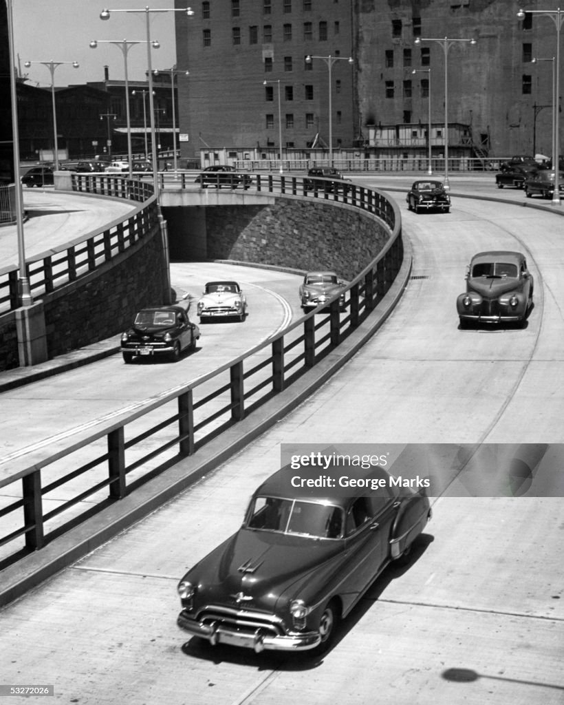 1940's autos on urban highway