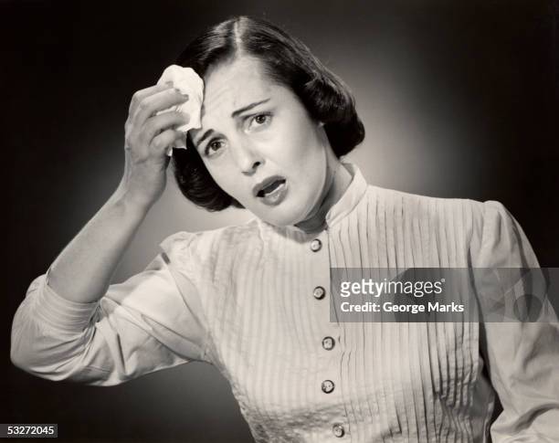 a woman wiping her brow with a handkerchief - the paley center for media celebrates american horror story the style of scare stockfoto's en -beelden