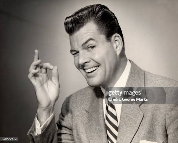 smiling man making a-ok sign with hand - ok sign stock pictures, royalty-free photos & images