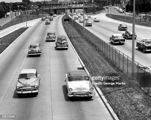 various american autos on highway - 1950's cars ストックフォトと画像