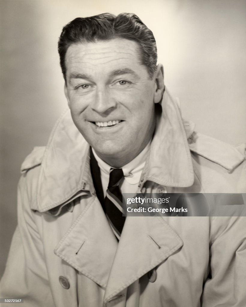 Portrait Of A Man In Trench Coat Smiling High-Res Stock Photo - Getty ...
