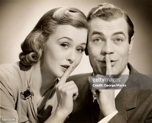 couple with secret - woman hush stock pictures, royalty-free photos & images