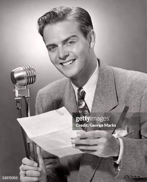 man talking into microphone - radio dj stock pictures, royalty-free photos & images