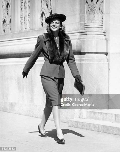 fashionable woman walking on street - 1940s fashion stock pictures, royalty-free photos & images