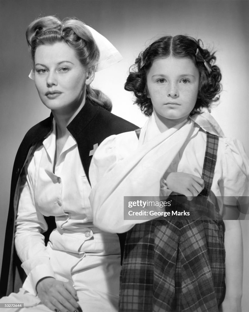 Nurse with young girl with arm in sling