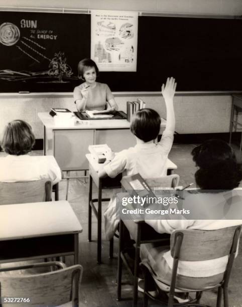 teacher conducts grade school class - vintage classroom stock-fotos und bilder