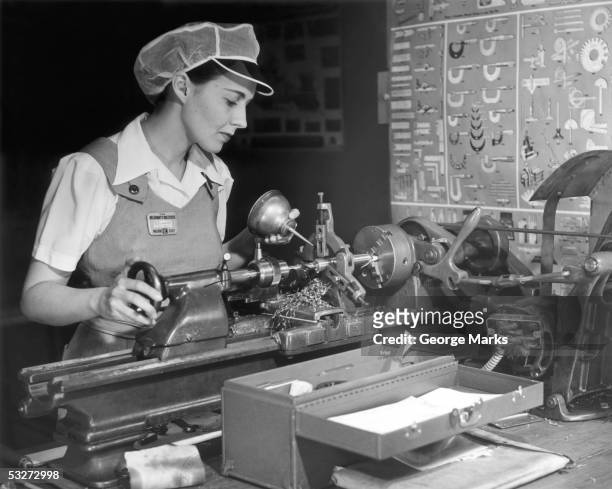 woman machinist at work - factory worker black and white stockfoto's en -beelden