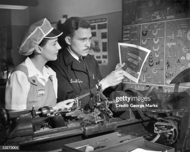 machinist instructor w/ woman apprentice - factory worker black and white stockfoto's en -beelden