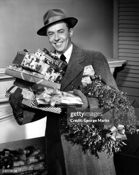 man with christmas gifts - black and white christmas imagens e fotografias de stock