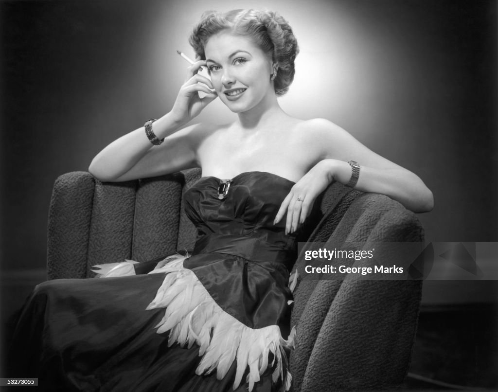 Woman in evening gown relaxing