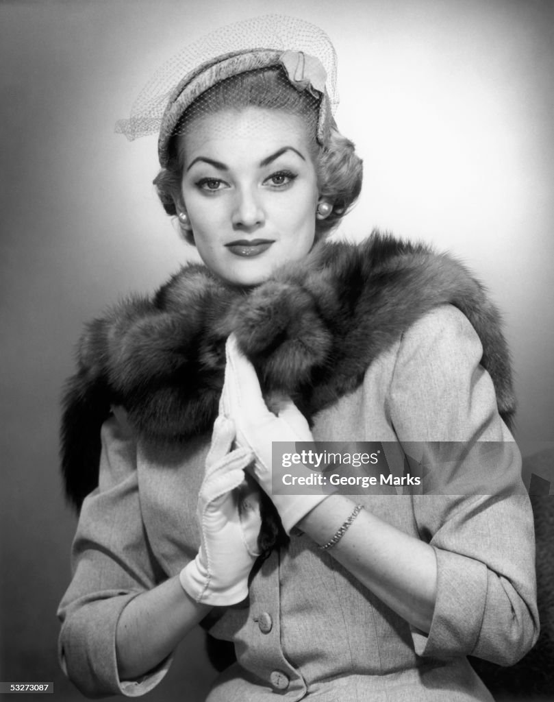 Fashionable woman in suit & furs & hat