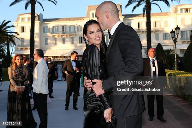 Model Adriana Lima and her boyfriend Joe Thomas attend the amfAR's 23rd Cinema Against AIDS Gala at Hotel du Cap-Eden-Roc on May 19, 2016 in Cap...