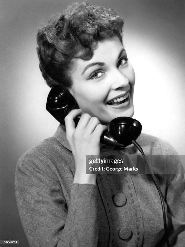 Woman laughing while on the phone