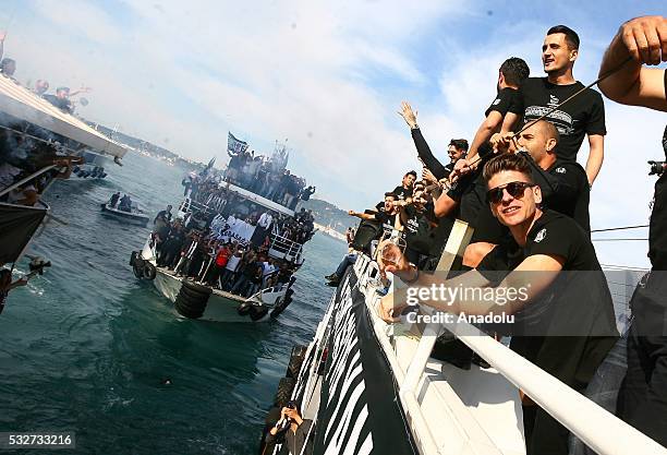 Mario Gomez of Besiktas is seen as he boats carrying Besiktas fans and the team players sail from Kandilli to Dolmabahce during the Besiktas' Turkish...