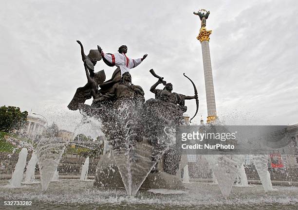 Figure on the monument to Kiev city founders dressed in Ukrainian National costumes named vyshyvanka at the Independence Square in Kiev, Ukraine, 19...