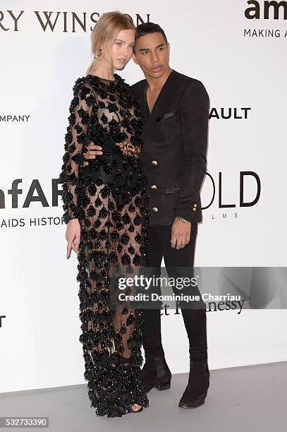 Stylist Olivier Rousteing and model Sasha Luss attend the amfAR's 23rd Cinema Against AIDS Gala at Hotel du Cap-Eden-Roc on May 19, 2016 in Cap...