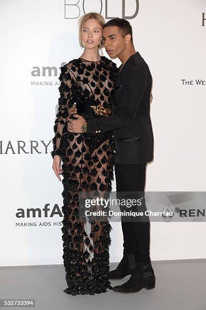 Stylist Olivier Rousteing and model Sasha Luss attend the amfAR's 23rd Cinema Against AIDS Gala at Hotel du Cap-Eden-Roc on May 19, 2016 in Cap...