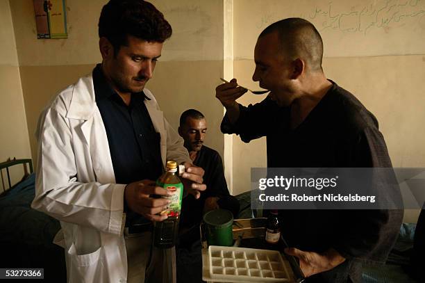 At the Nejat Center for Drug Rehabilitation in Kabul, Afghanistan July 11 heroin and opium drug addicts are given vitamins and medicine during a...