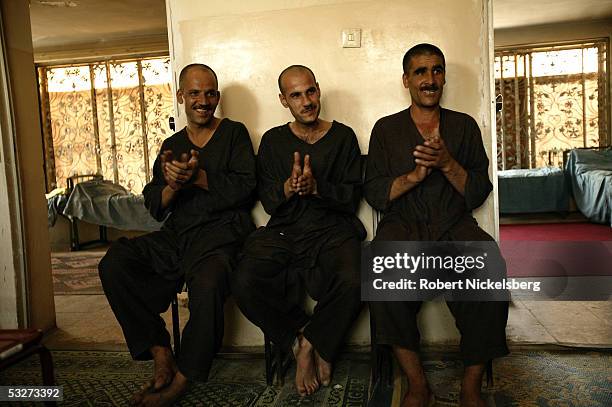 At the Nejat Center for Drug Rehabilitation in Kabul, Afghanistan July 11 heroin and opium drug addicts applaud during a daily group therapy meeting....