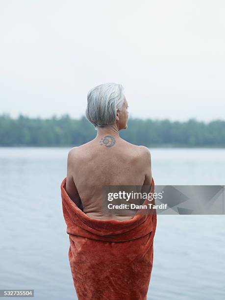 senior woman with tattoo - back tattoo stock pictures, royalty-free photos & images