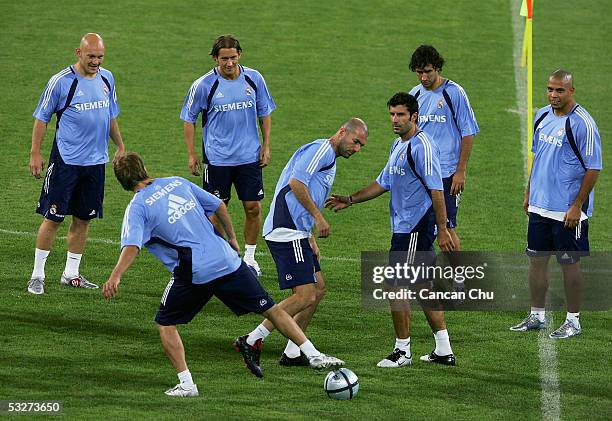 Players of the Real Madrid play with a football during a training session at the Teda Stadium on July 22, 2005 in Tianjin, China. Real Madrid are on...