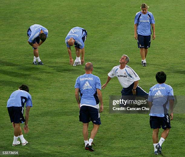 Players of the Real Madrid take part in a training session with their coach at the Teda Stadium on July 22, 2005 in Tianjin, China. Real Madrid are...