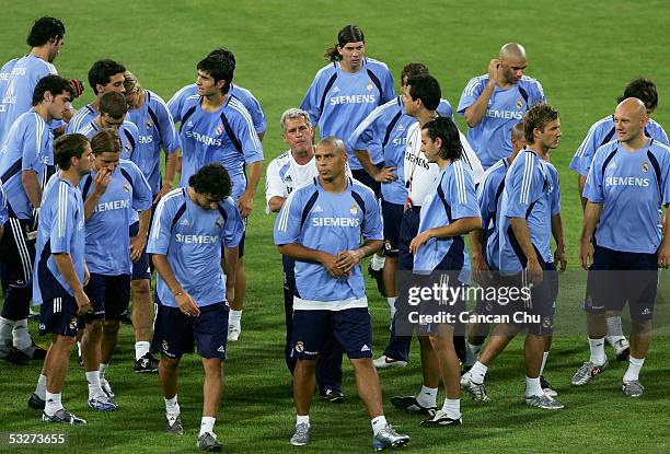 Players of the Real Madrid listen to their coach during a training session at the Teda Stadium on July 22, 2005 in Tianjin, China. Real Madrid are on...