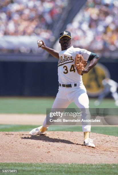 Pitcher Dave Stewart of the Oakland Athletics delivers a pitch during an August 1990 game at the Oakland-Alameda County Coliseum in Oakland,...