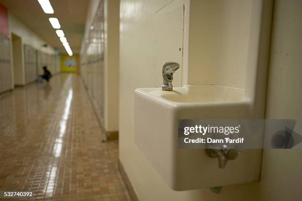 drinking fountain in school hallway - drinking fountain stock pictures, royalty-free photos & images